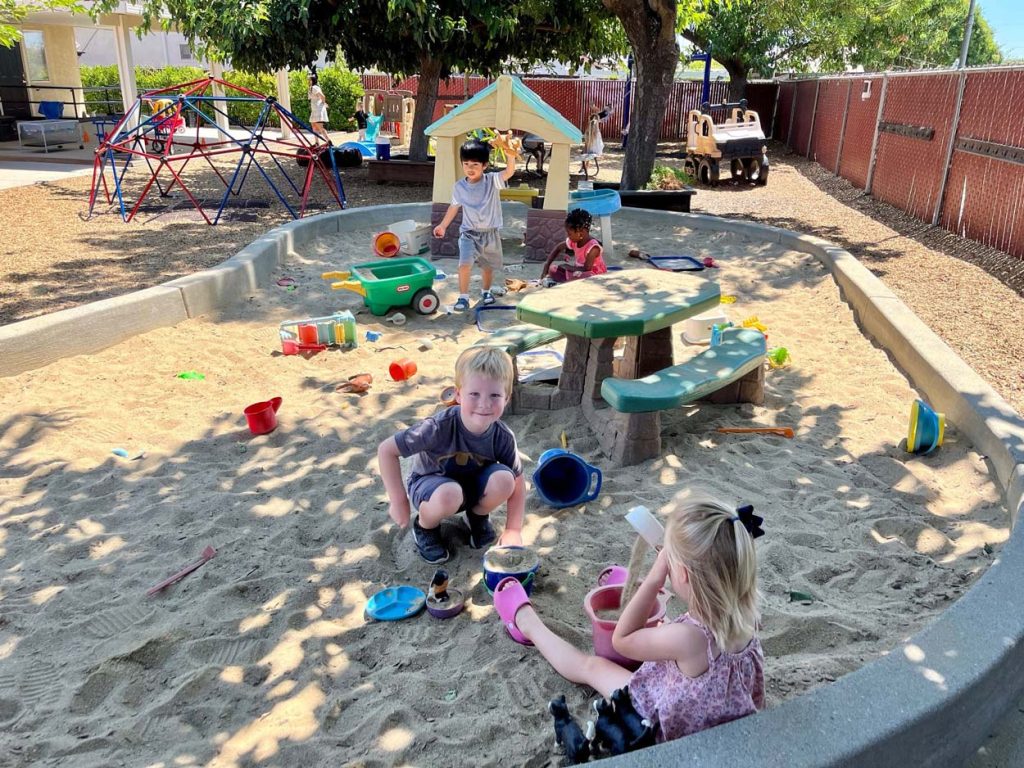 Oakley 3 Sunshine House, CA Oakley preschool classroom, children and teacher, outside 1