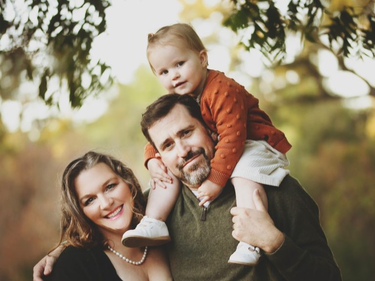 Reviews 14 Sunshine House family portrait outdoors with their toddler