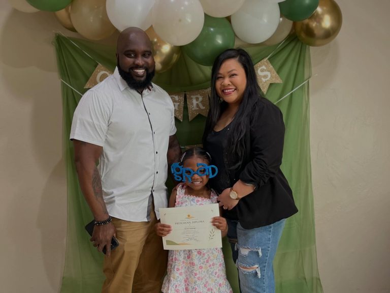 Reviews 26 Sunshine House family celebrating their daughter's preschool graduation